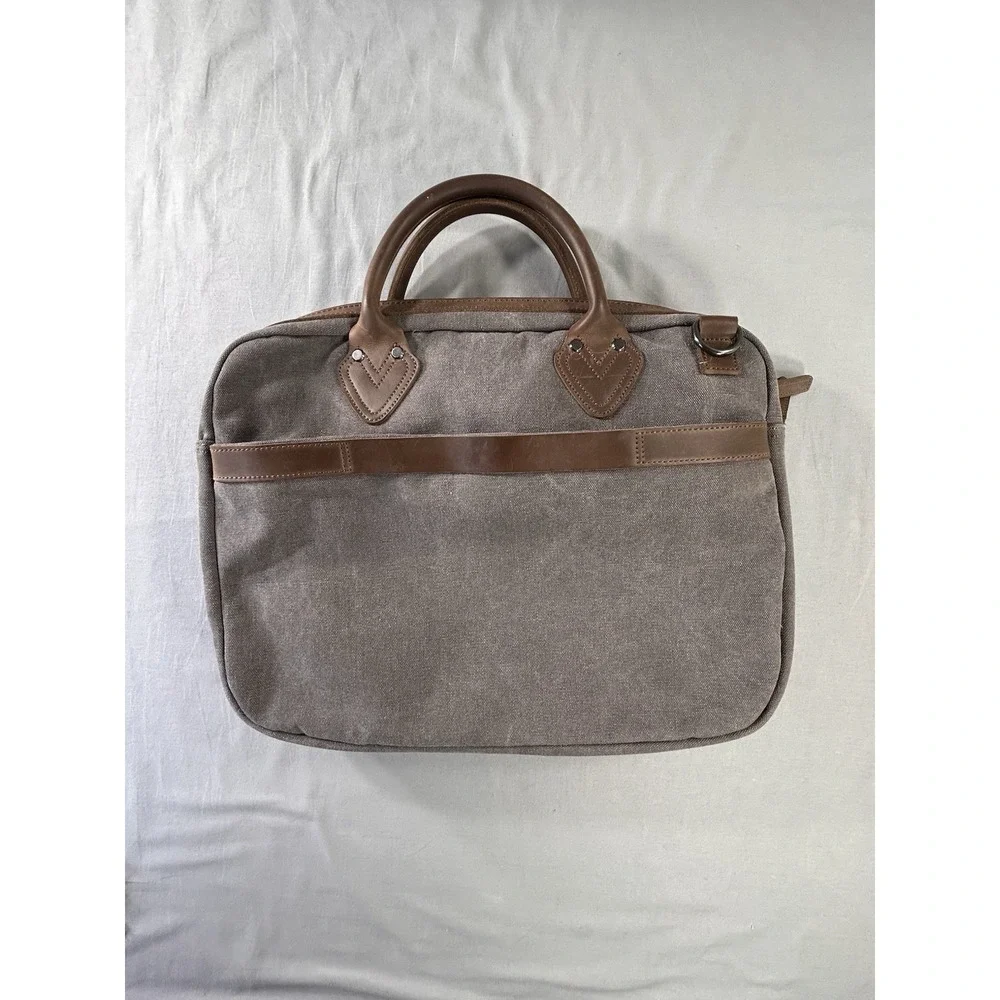 Renwick canvas briefcase featuring genuine leather trim missing shoulder strap